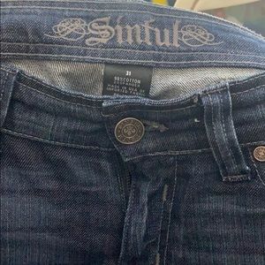 Sinful Size 31 dark wash denim.